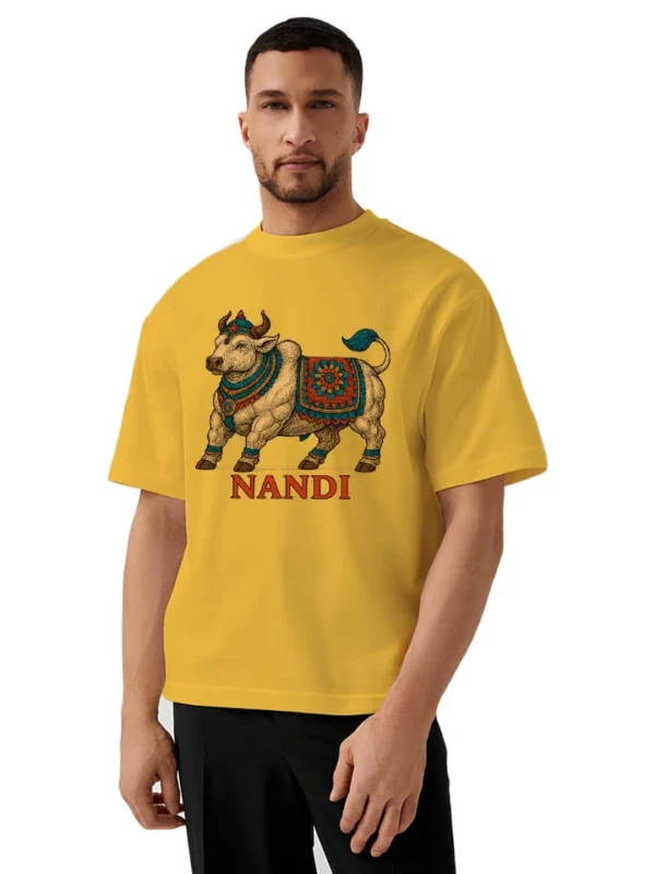 Gen-Z model wearing oversized Nandi t-shirt in yellow with cultural print